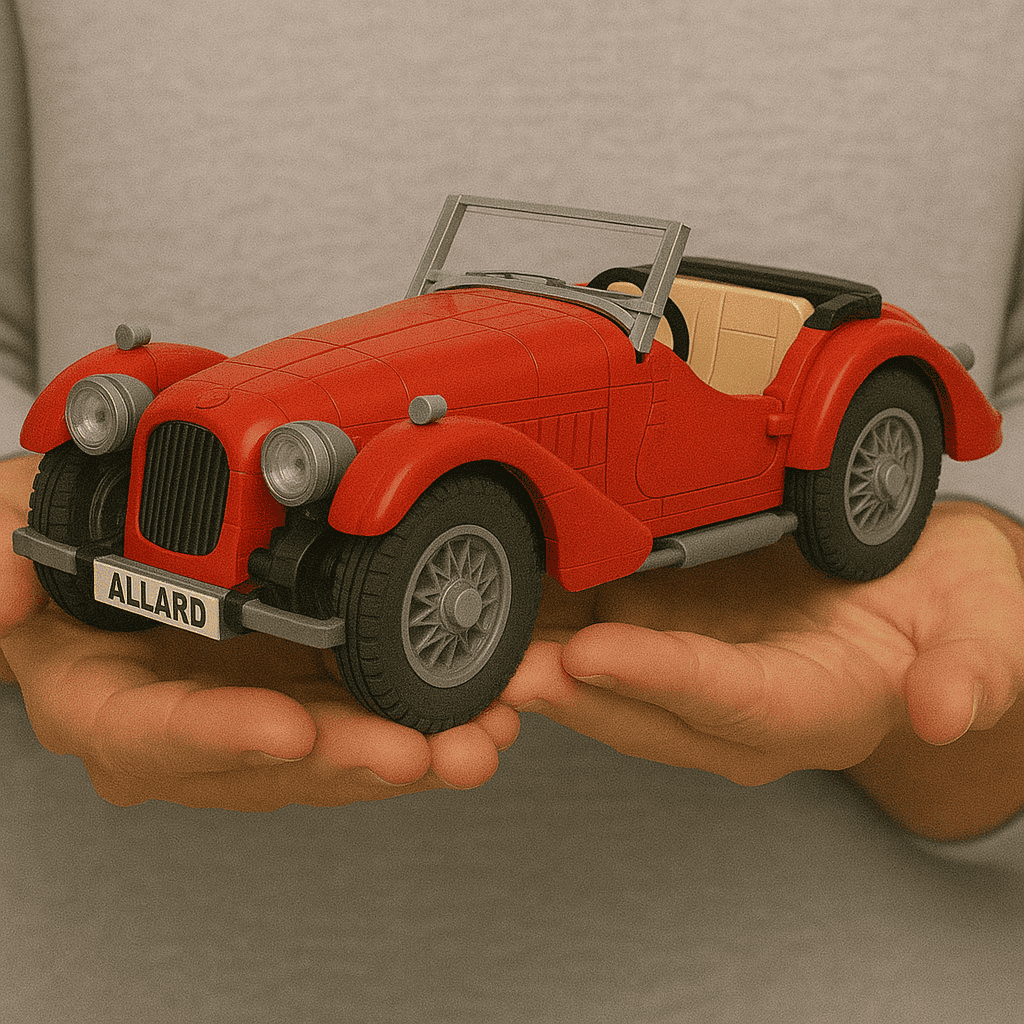 Vintage toy car LEGO model in red with detailed design and license plate "ALLARD".