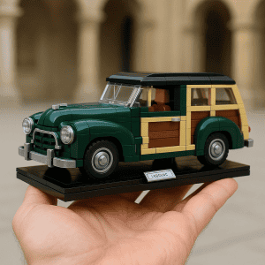 LEGO vintage station wagon model on black display base in hand.