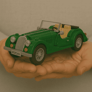 Miniature green LEGO vintage convertible car with beige interior on hand.